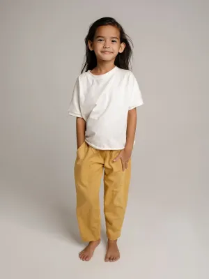 Unisex children organic pants in yellow